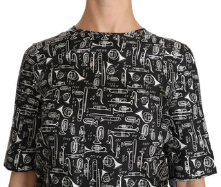 Schwarze Bluse aus Seide mit Aufdruck von Musikinstrumenten