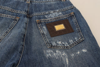 Jeans de mezclilla azul lavado de algodón con desgastados