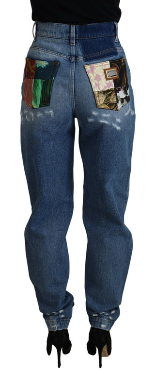Jeans ajustados azules de algodón con desgastes