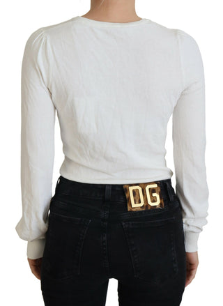 Blusa de mujer color marfil con cuello en V y mangas largas