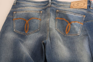 Jeans de mezclilla azul lavado de cintura media y corte ajustado