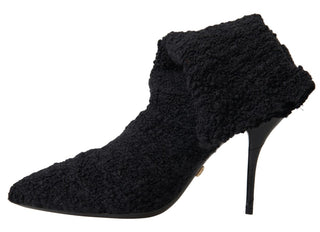 Botas negras de tacón de aguja hasta media pantorrilla