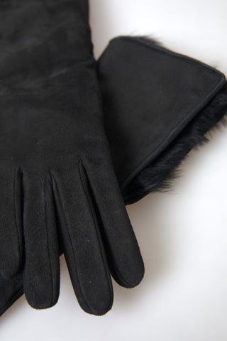 Schwarze lederne, ellenbogenlange Handschuhe mit Fell
