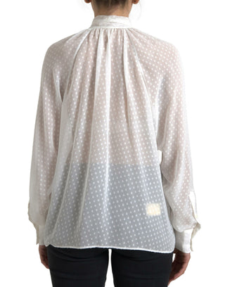 Blusa blanca de seda transparente con cuello atado y lunares
