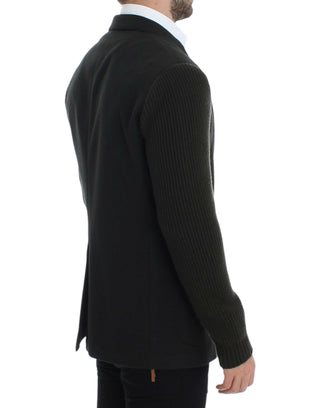 Black ribbed sweater worn by a person on a white background