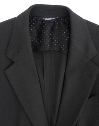 Black Dolce & Gabbana blazer with a polka dot lining on a white background