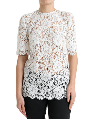Blusa blanca de algodón con encaje floral y cuello redondo