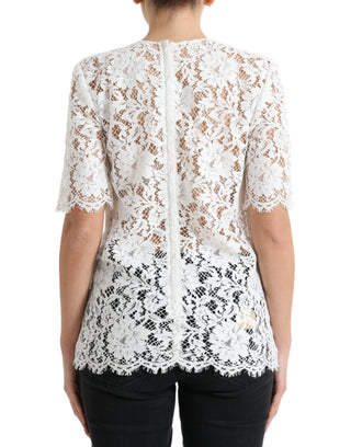 Blusa blanca de algodón con encaje floral y cuello redondo