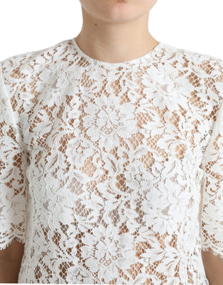 Blusa blanca de algodón con encaje floral y cuello redondo