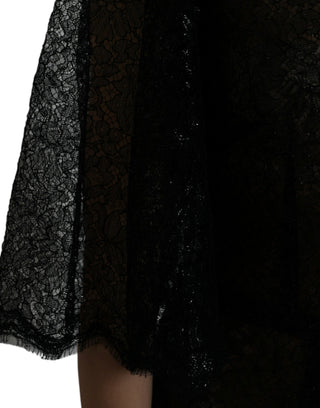Vestido midi negro en línea A con encaje floral y transparencia