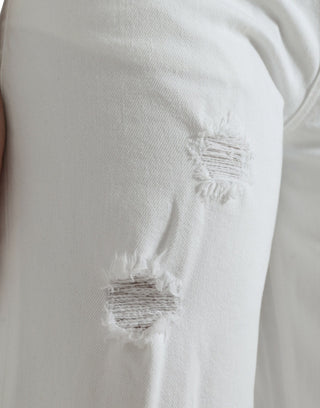 Jeans de algodón blanco, corte ancho y tobilleros