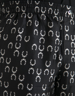 Pantalones negros de seda con estampado de herradura