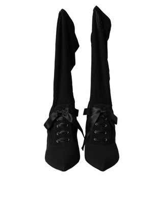 Botas negras de tacón stiletto hasta media pantorrilla