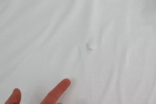 Top sin mangas blanco de algodón con aplique de corazón