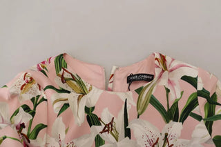 Vestido rosa de viscosa con forma ajustada y largo hasta la rodilla