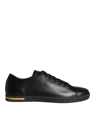 Zapatillas clásicas de cuero negro y dorado