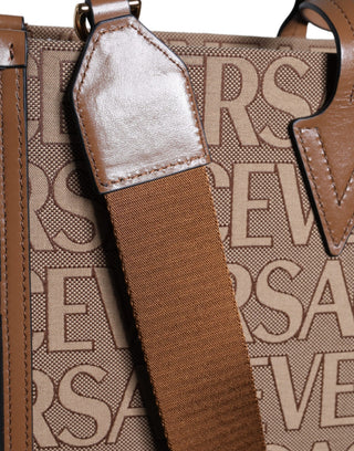 Bolso tote cruzado de jacquard y cuero marrón con logo y asa superior