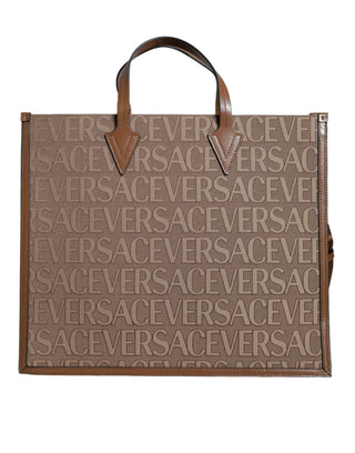 Bolso tote cruzado de jacquard y cuero marrón con logo y asa superior