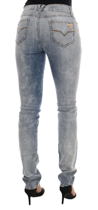 Jeans slim fit de algodón con lavado azul desgastado