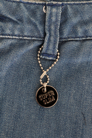 Jeans de denim slim de algodón con lavado azul