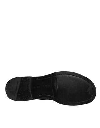 Schwarze kniehohe Lederstiefel