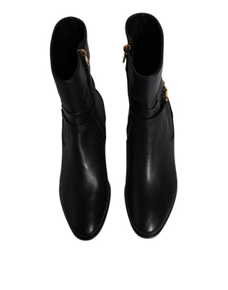 Schwarze Leder-Stiefel mit Logo bis zur Mitte der Wade