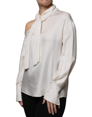 Blusa beige de seda con cuello ascot y mangas largas
