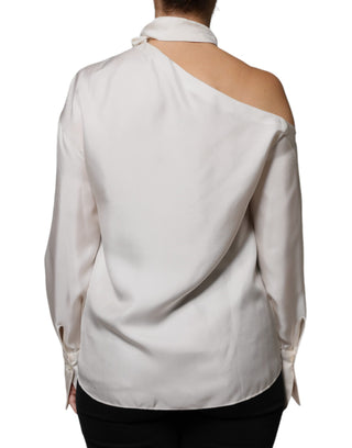 Blusa beige de seda con cuello ascot y mangas largas