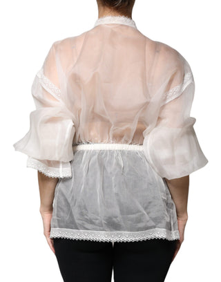 Blusa blanca de seda con cuello ascot y mangas largas