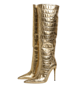 Botas altas doradas de cuero con tacones de aguja