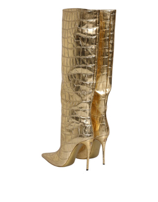 Botas altas doradas de cuero con tacones de aguja