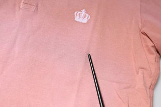 Polo rosa con cuello y corona, manga corta