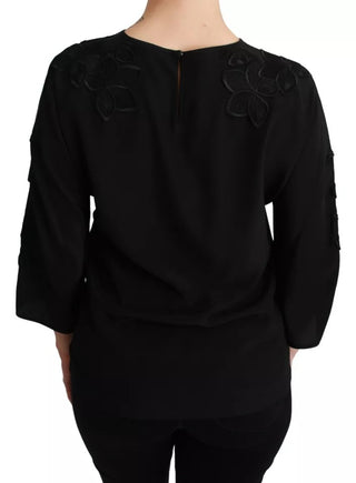 Blusa negra de seda con bordado floral