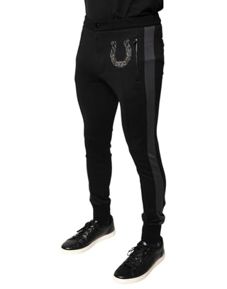 Pantalones ajustados de lana negra con adorno de herradura