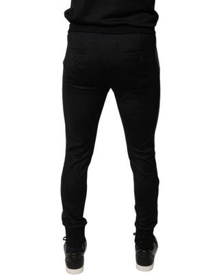 Pantalones ajustados de lana negra con adorno de herradura