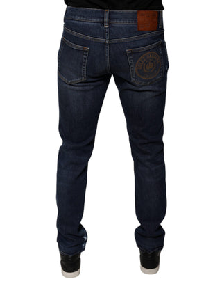 Jeans ajustados de mezclilla azul oscuro con logo de algodón
