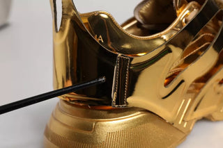 Zapatillas bajas de cuero dorado Daymaster