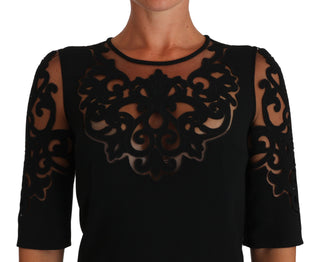 Vestido de cóctel negro con patrón de corte floral