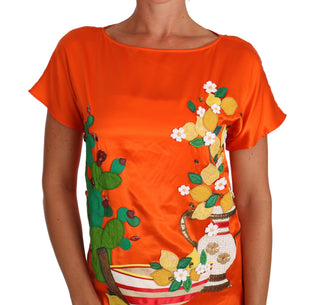 Top de camiseta de seda naranja con limón