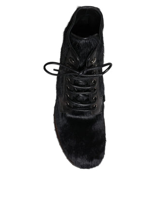 Botas negras de cuero estilo pony hasta media pantorrilla