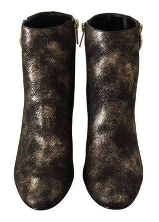 Botines negros de cuero con tacones de bloque y cremallera