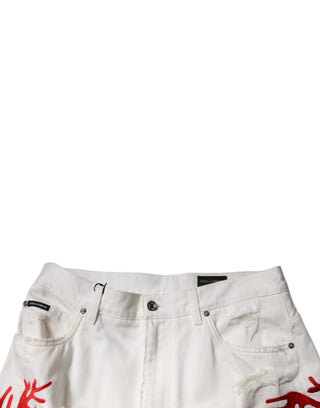 Jeans de mezclilla rectos desgastados con corales blancos