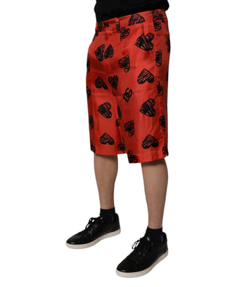 Orangefarbene Seiden-Bermudashorts mit Herzaufdruck