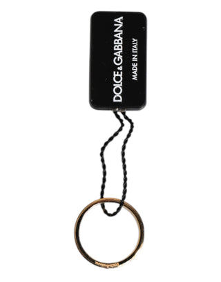 Goldfarbener Messingring mit roten Kristallen und DG Logo