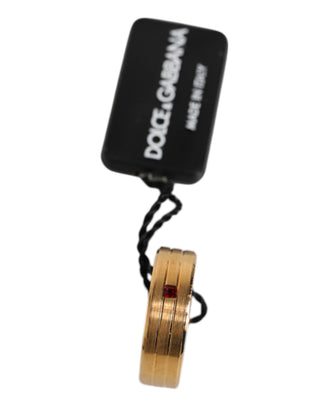 Goldfarbener Messingring mit roten Kristallen und DG Logo
