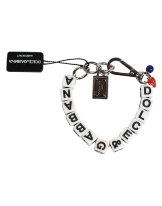 Pulsera con cadena de latón plateado y dijes de dados con logo  
