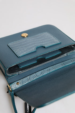Grüne Crossbody-Minitasche aus exotischem Leder mit DG-Plakette
