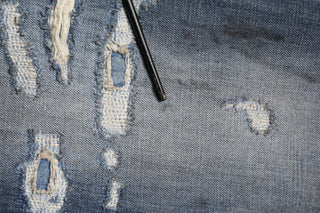 Jeans para hombre de algodón lavado azul con desgastes