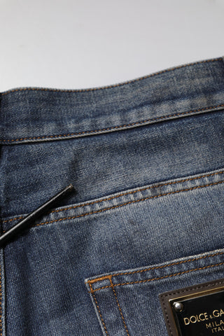 Jeans para hombre de algodón lavado azul con desgastes