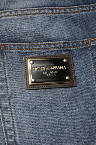 Jeans para hombre de algodón lavado azul con desgastes